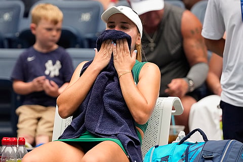 US Open 2024: Sofia Kenin, of the United States, wipes sweat from her face during a break between games against Jessica Pegula, of the United States